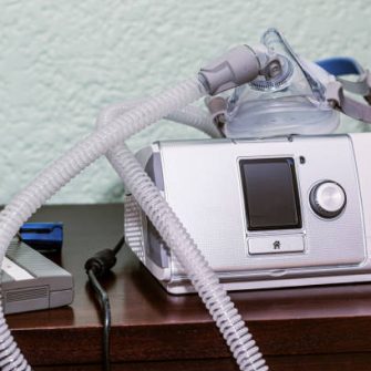 Cpap and pulse oxymeter on bedroom’s nightstand,